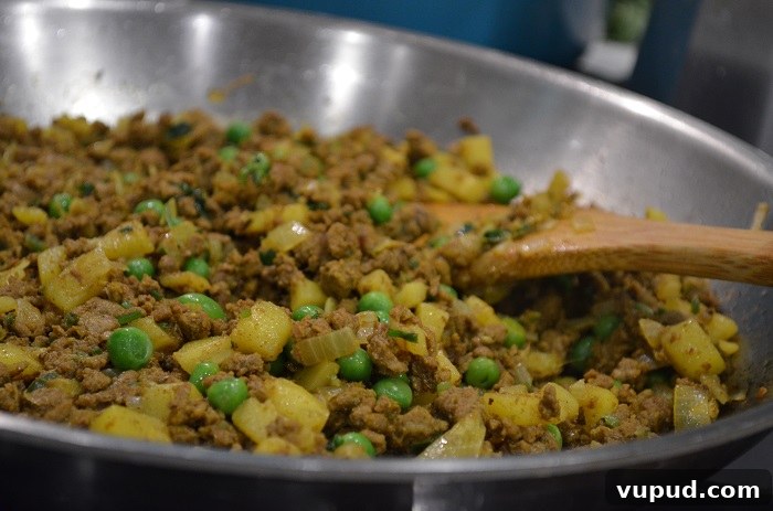 Crispy Beef Samosa Puff Pastries: Flaky Indian-Inspired Bites 17 stir