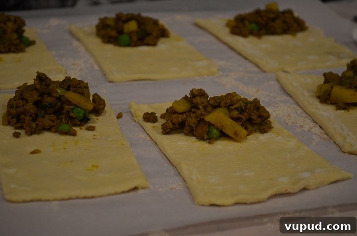 Crispy Beef Samosa Puff Pastries: Flaky Indian-Inspired Bites 19 place meat in middle