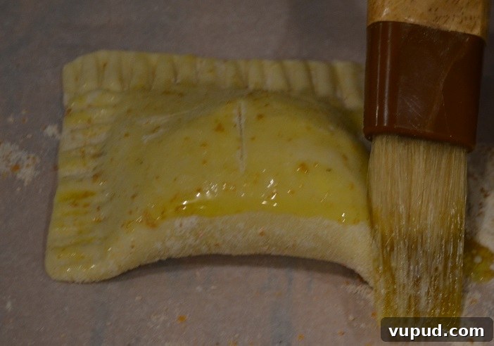 Crispy Beef Samosa Puff Pastries: Flaky Indian-Inspired Bites 23 brushing each one