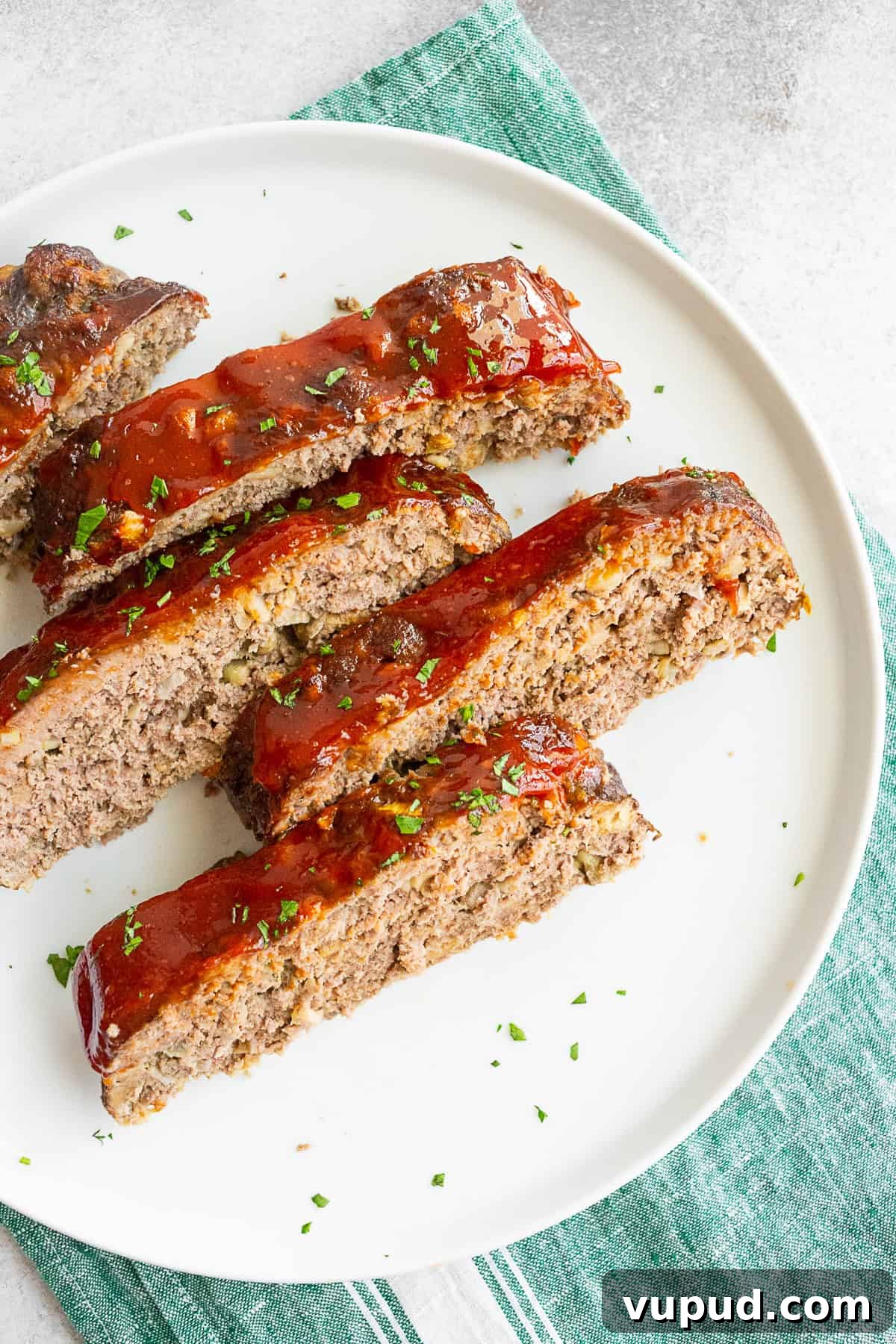 Classic Homemade Beef Meatloaf Recipe for Comforting Dinners 4 Classic Beef Meatloaf sliced into pieces for serving.