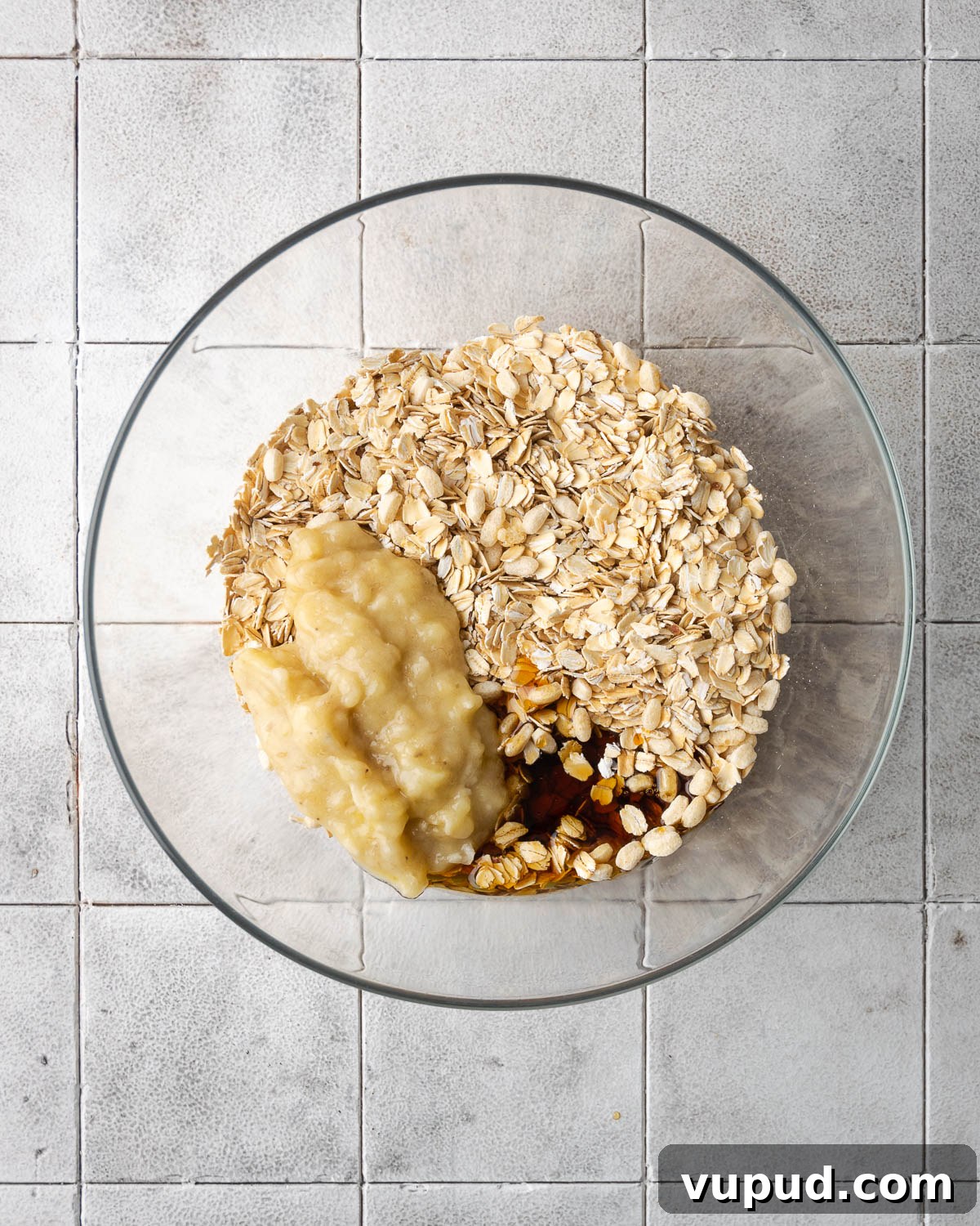 Homemade Chocolate Banana Granola Recipe for Crunchy Breakfast 5 Ingredients for banana granola in a large glass bowl.