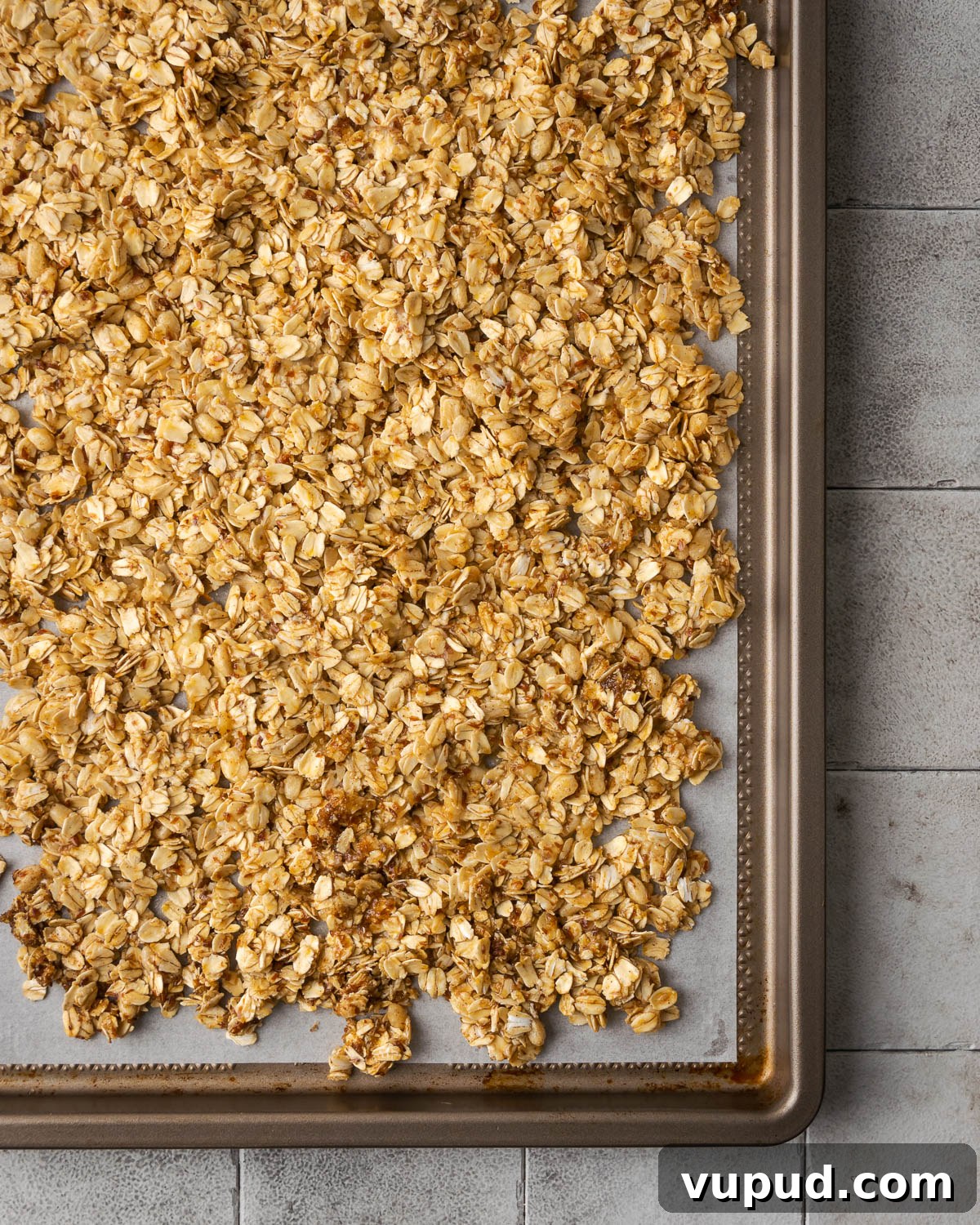 Homemade Chocolate Banana Granola Recipe for Crunchy Breakfast 7 Unbaked granola spread onto a large baking sheet.
