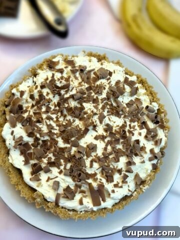 A banoffee pie decorated with chocolate curls.