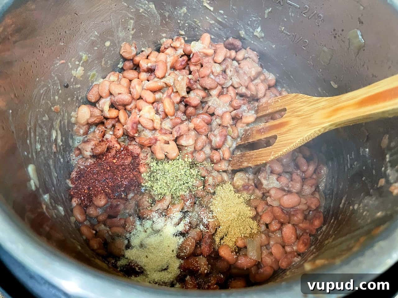 Authentic Mexican-Style Beans in the Instant Pot: Flavorful & Fast 5 pinto beans with spices after being cooked in the instant pot.