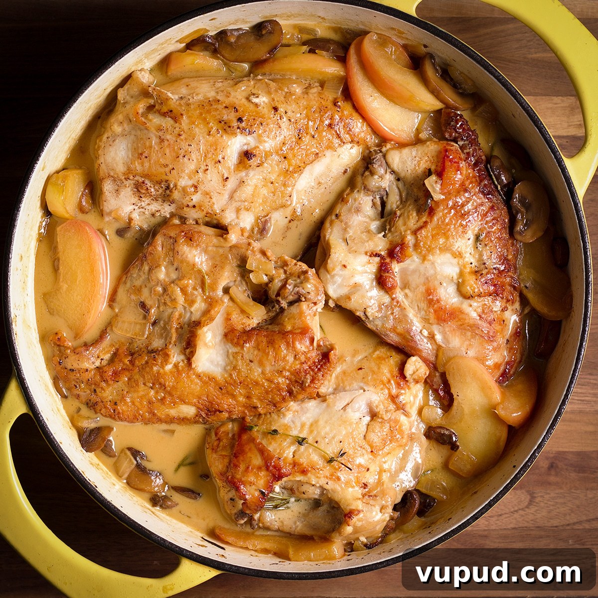 Chicken, Apples & Mushrooms in Cider Cream Sauce 11 A pan filled with chicken in cider cream sauce.