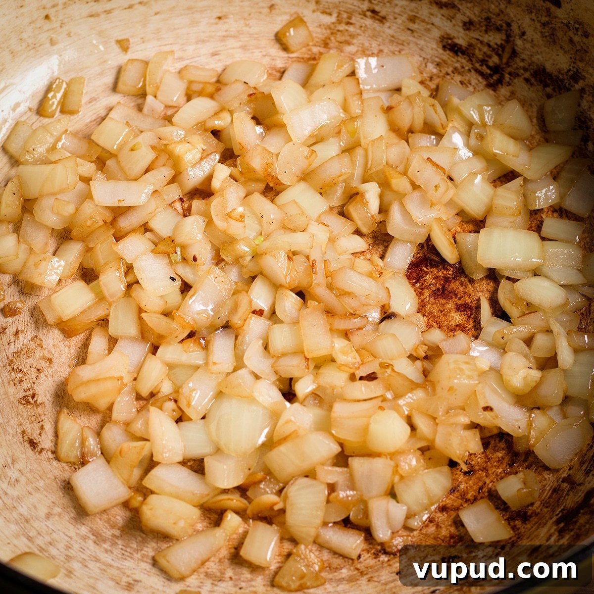 Chicken, Apples & Mushrooms in Cider Cream Sauce 8 Chopped onions cooking in a pan until soft and golden.