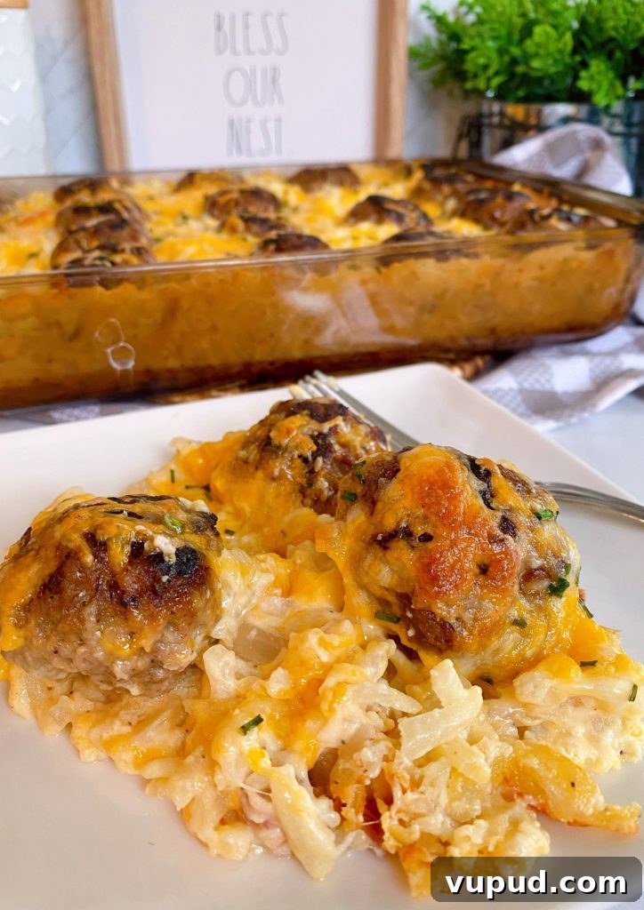 Cheesy Meatball and Hash Brown Casserole Recipe 10 Cheesy Hash brown and Meatball Casserole in a baking dish, with a serving plate full of the casserole in front.