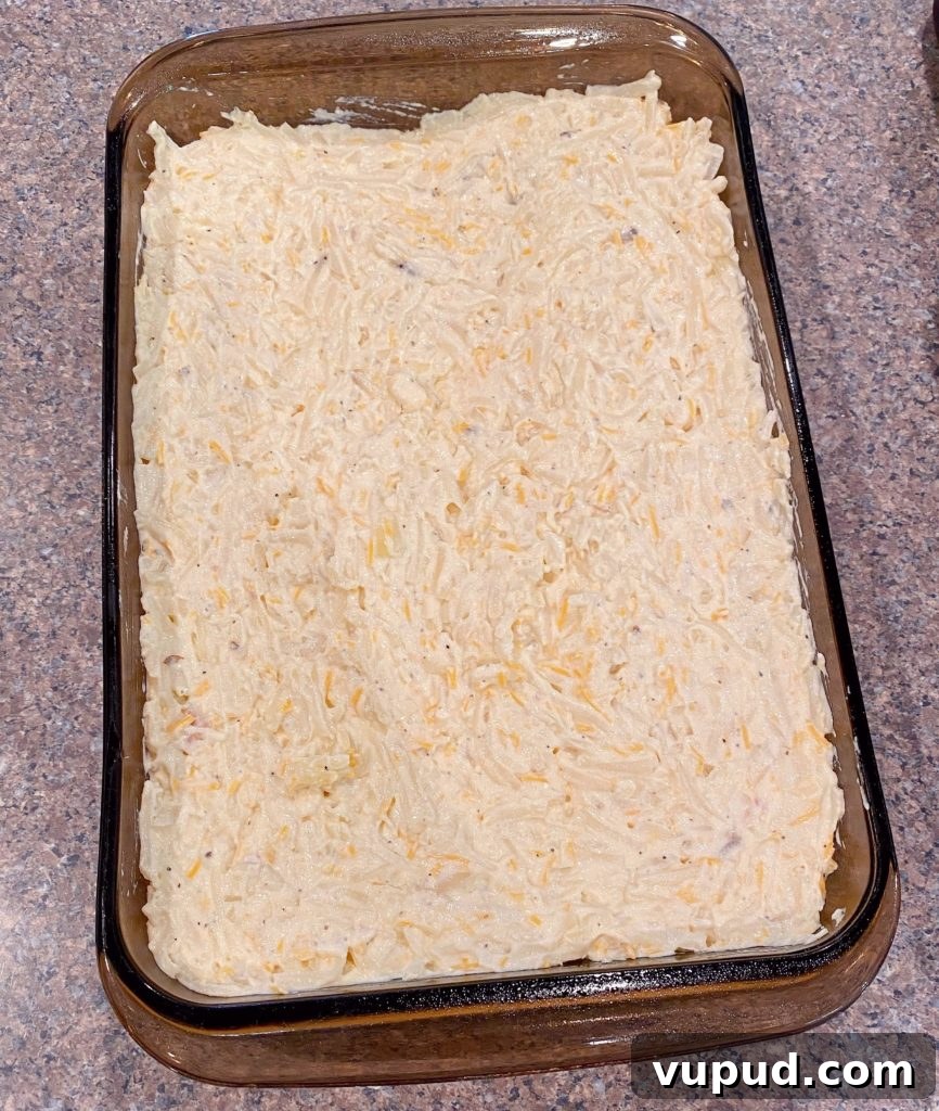Cheesy Meatball and Hash Brown Casserole Recipe 7 Baking dish filled with cheesy potatoes.
