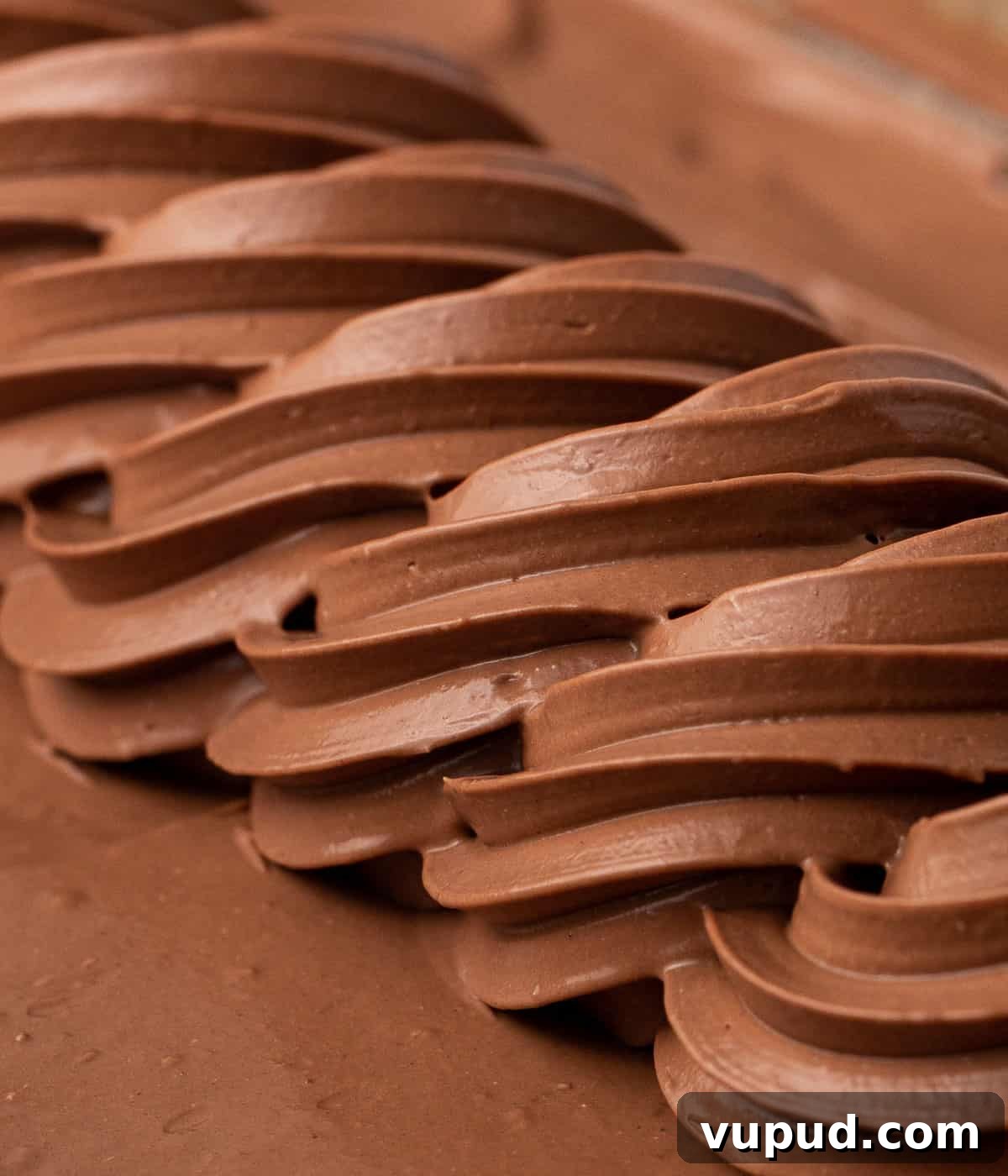 Namelaka: Silky Chocolate Cream Ganache Recipe and Guide 8 Macro shot of a swirl of piped cream.