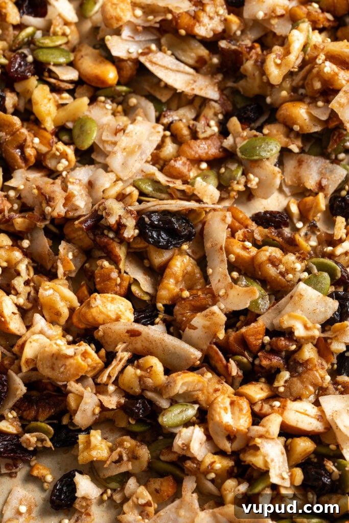 Grain-Free Homemade Granola Recipe for Crunchy, Low-Carb Mornings 14 closeup shot of homemade grain-free granola with nuts, seeds, quinoa, coconut flakes, maple, and vanilla.