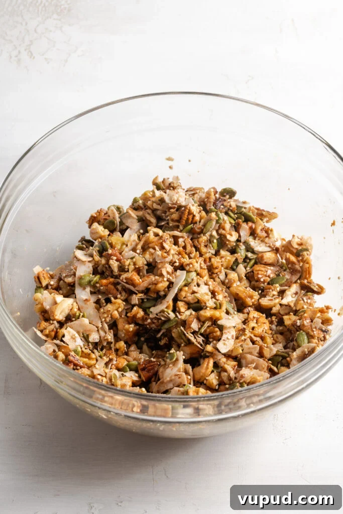 Grain-Free Homemade Granola Recipe for Crunchy, Low-Carb Mornings 10 grain free granola mixture in a bowl after tossing with the wet ingredients.