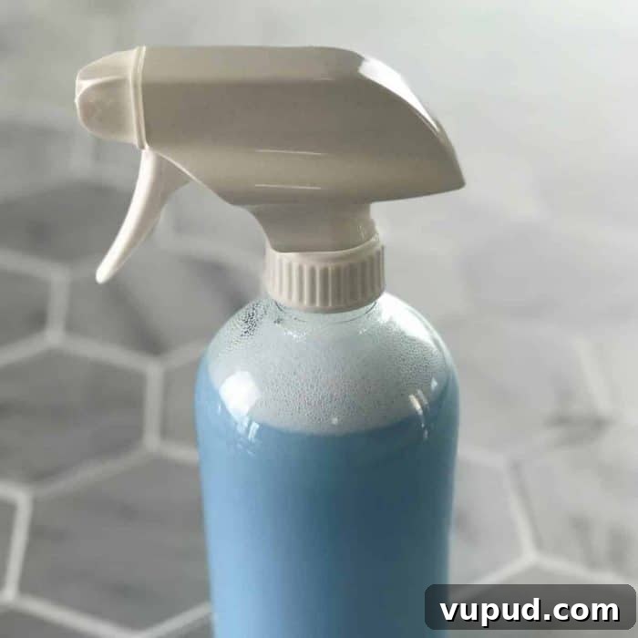 DIY Shower Cleaner Recipe for Sparkling, Streak-Free Tiles 7 Finished homemade shower cleaner in spray bottle