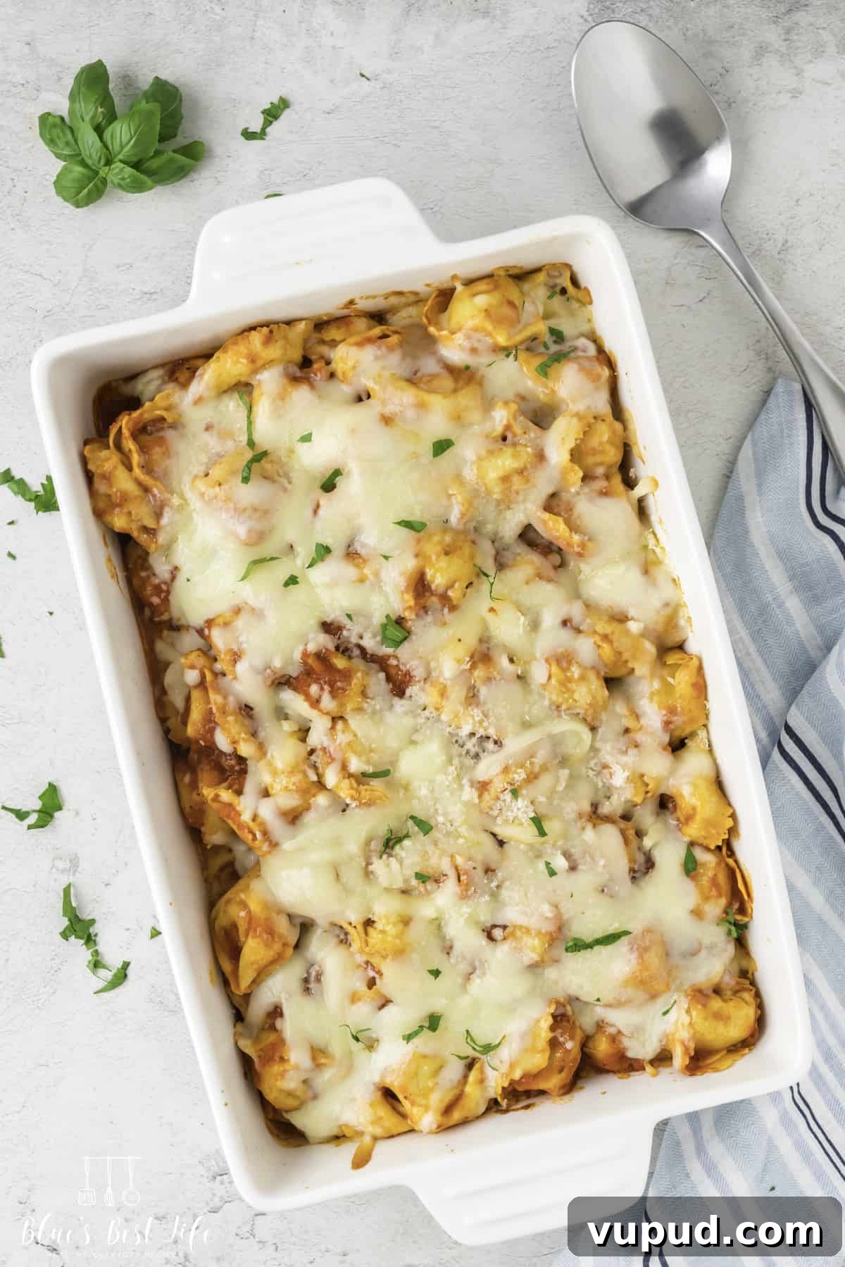 Cheesy Tortellini Casserole Bake with Garlic Parmesan Crust 2 A casserole dish with tortellini pasta with cheese.