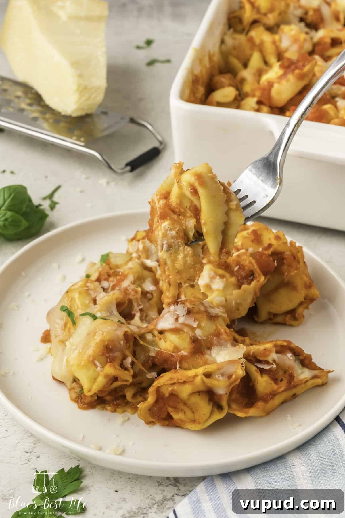Cheesy Tortellini Casserole Bake with Garlic Parmesan Crust 9 A serving of tortellini pasta casserole served on a plate.