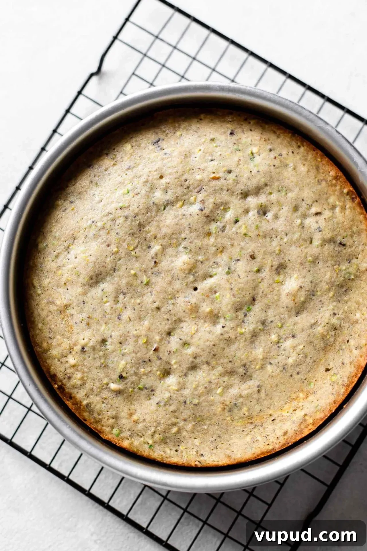 Silky Pistachio Layer Cake with Toasted Nut Crumble 11 baked pistachio cake layer in cake pan