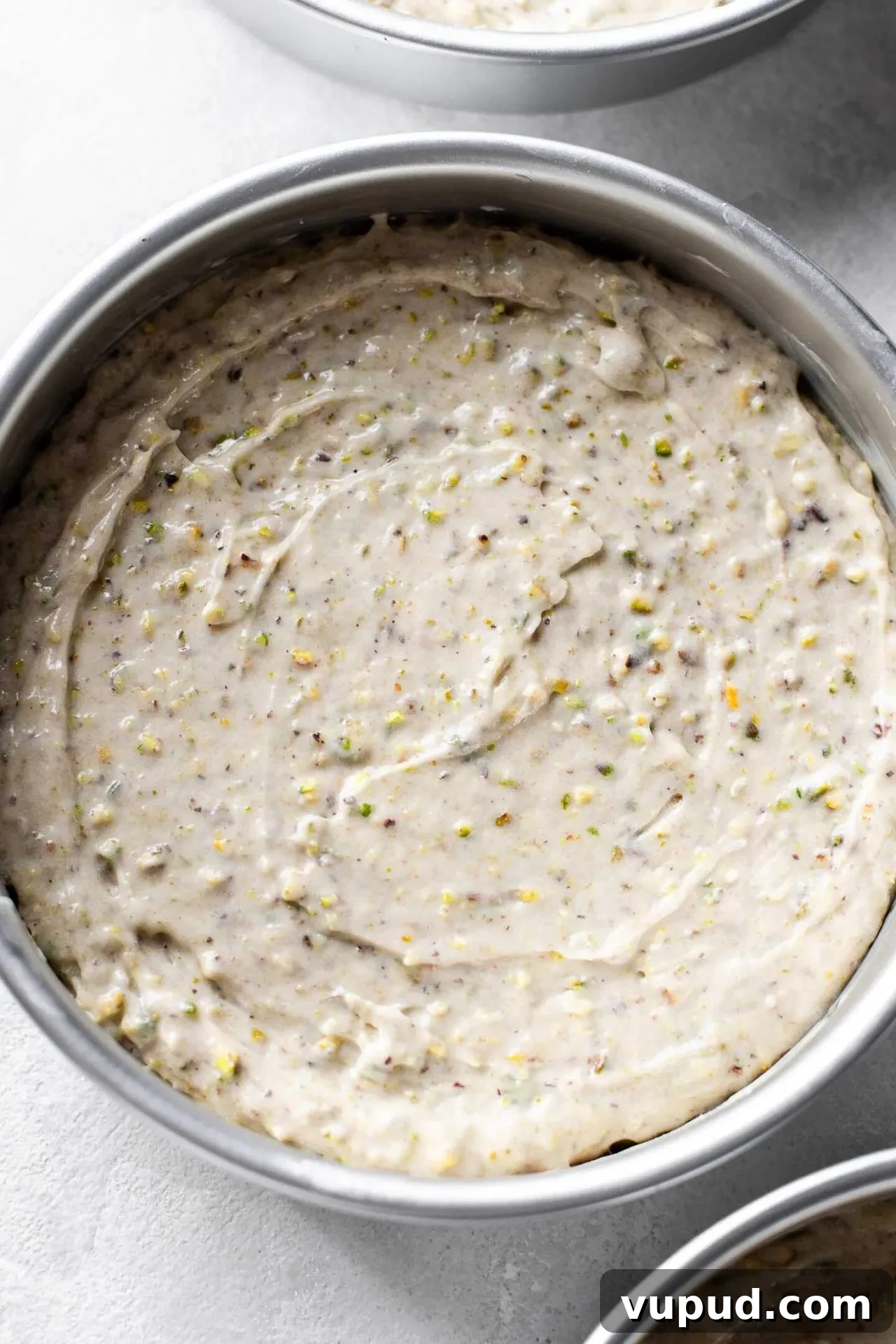 Silky Pistachio Layer Cake with Toasted Nut Crumble 10 pistachio cake batter in cake pan