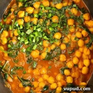 Slow-Cooked Chickpea and Spinach Curry (Chana Saag) 7 Chickpeas and spinach in a tomato, creamy sauce in the slow cooker for a vegetarian Chana Saag recipe.