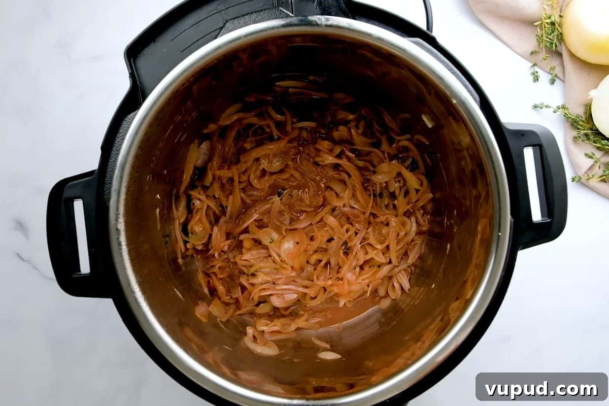 Pressure Cooker French Onion Soup Caramelized Onions inside inner pot after adding red wine and deglazing inner pot.