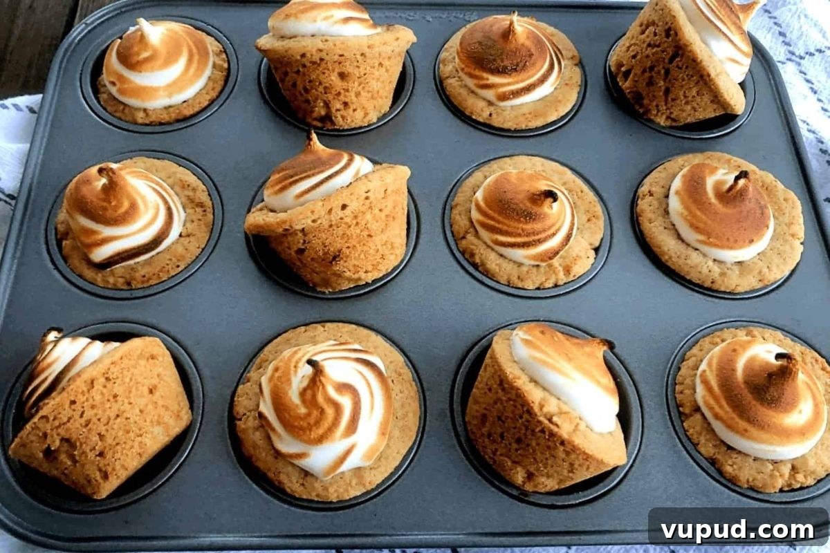 24 Irresistible S'mores Recipes to Enjoy All Year Long 21 Meringue cupcakes made in a muffin tin using Hershey Kiss recipes.