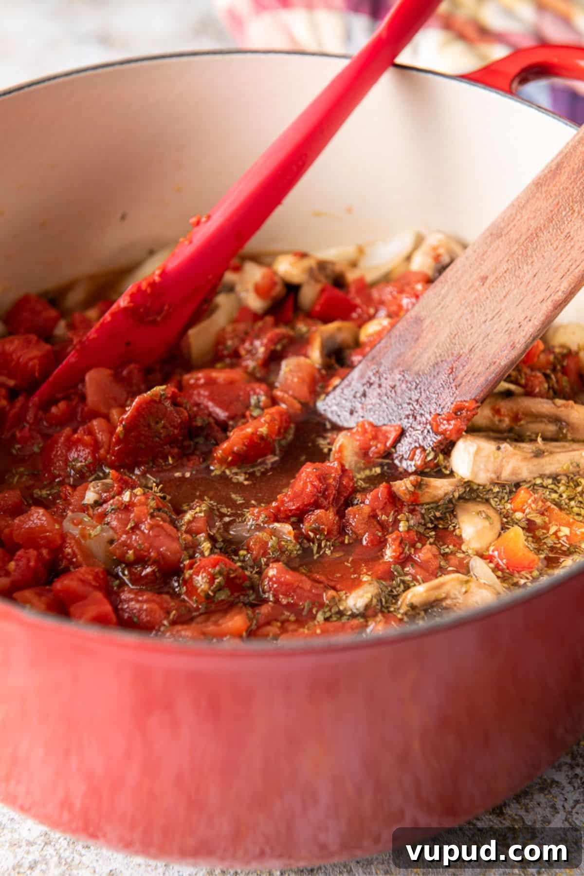 Rich Tomato Gravy Recipe: Savory Red Sauce for Pasta & Biscuits 7 Herbs and diced tomatoes and tomato paste added to the pan
