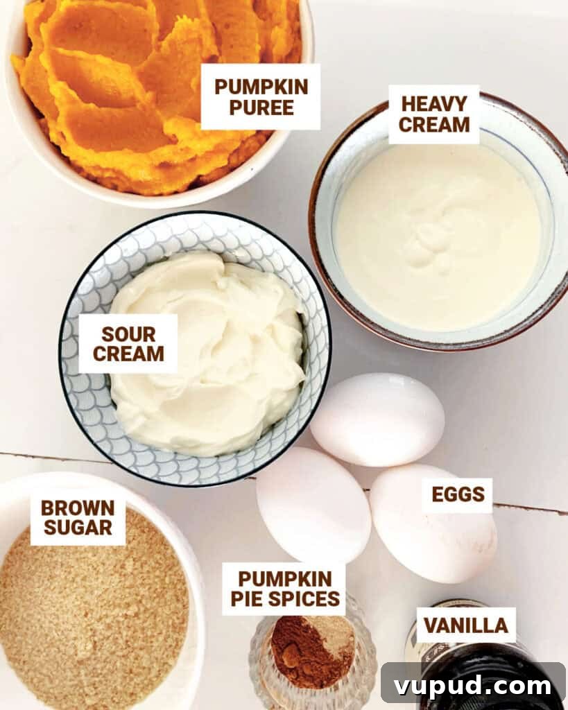 Pumpkin Pie with Graham Cracker Crust Recipe for Fall Baking 5 White surface with bowls containing ingredients for pumpkin pie with sour cream and brown sugar.
