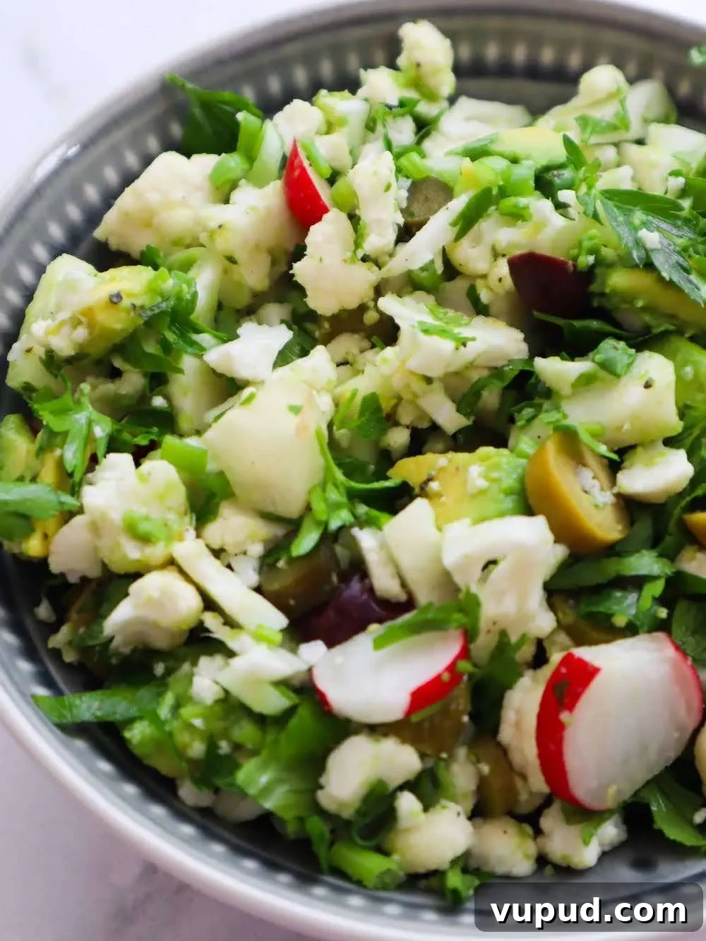 Bowl of raw cauliflower salad