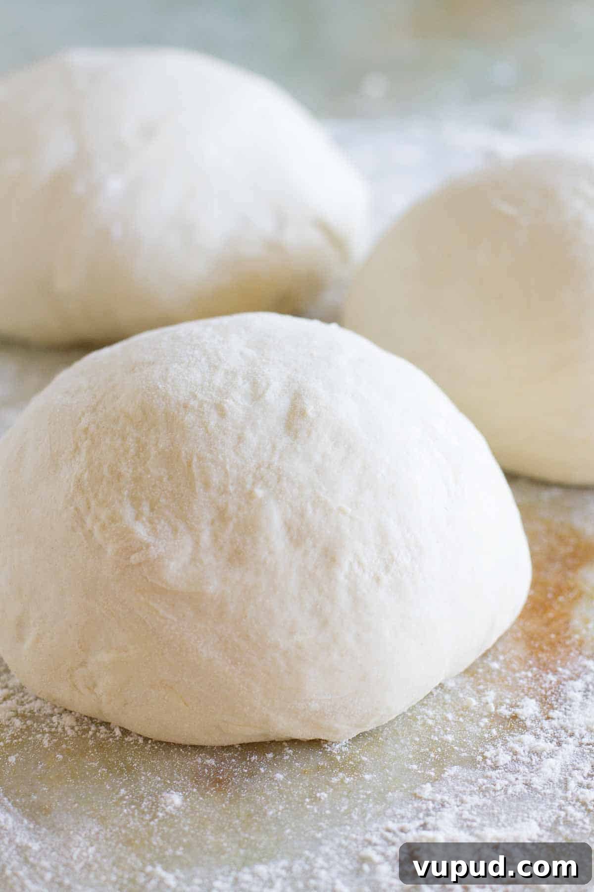 Homemade Pizza Dough balls of pizza dough with flour