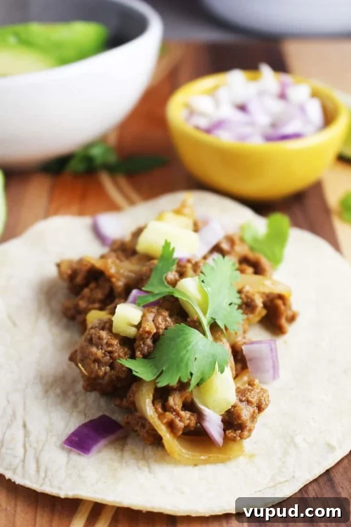 Al pastor style beef taco with toppings