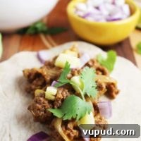Al pastor style beef taco with toppings