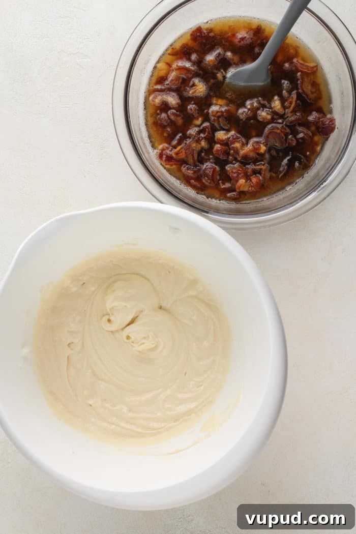 Decadent Date Cake Recipe with Warm Spices 6 Shortening, sugar, and egg mixture for cake in a white mixing bowl next to a bowl of soaked dates.