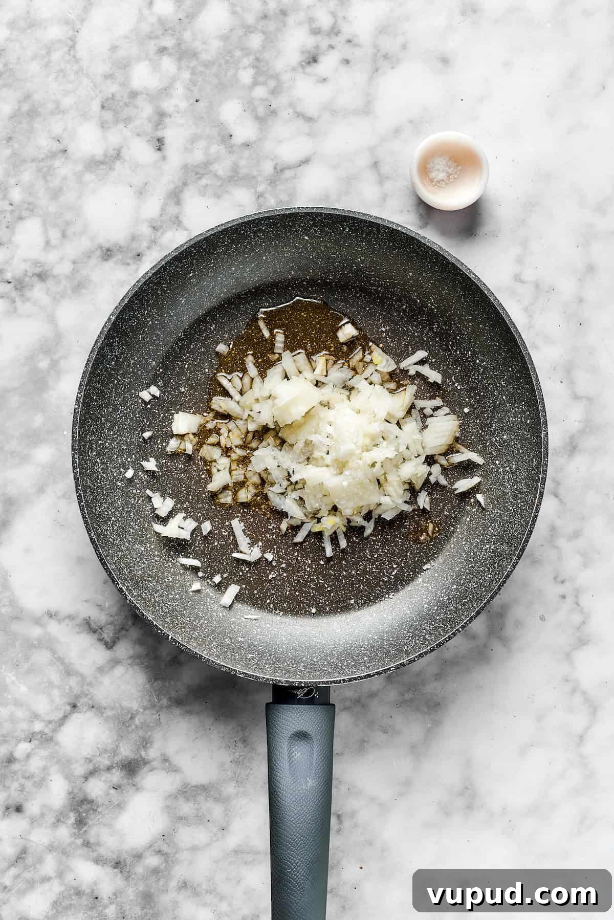 Cook the onions. Onions in a skillet ready to cook.