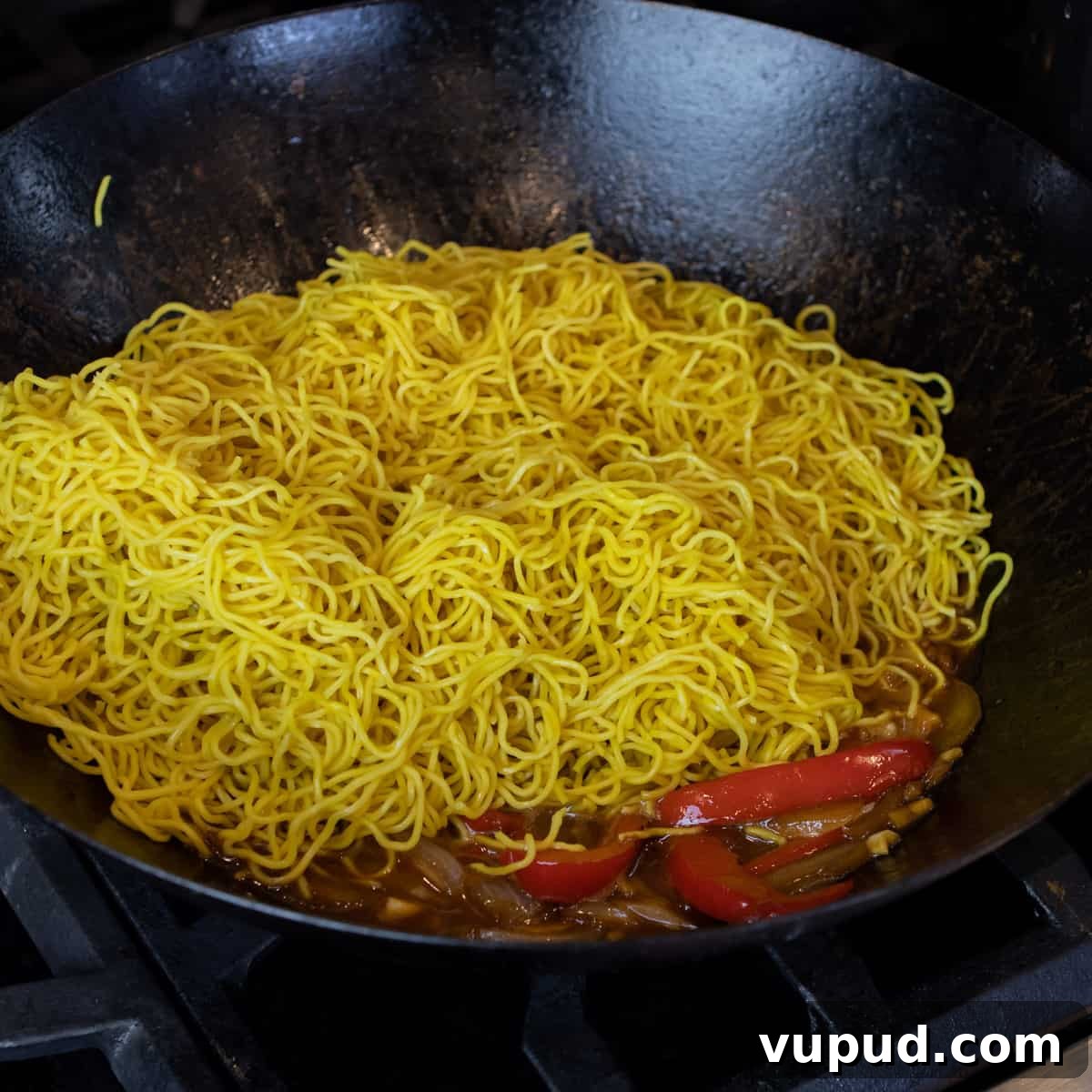 Vegetable Chow Mein Recipe: Flavorful Stir-Fry with Crunchy Veggies 6 Cooked Chinese noodles in a hot wok.