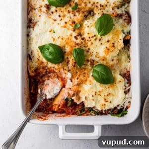 Spinach and Ricotta Ravioli Recipe: Homemade Pasta with Creamy Filling 4 casserole dish with baked ravioli and basil leaves