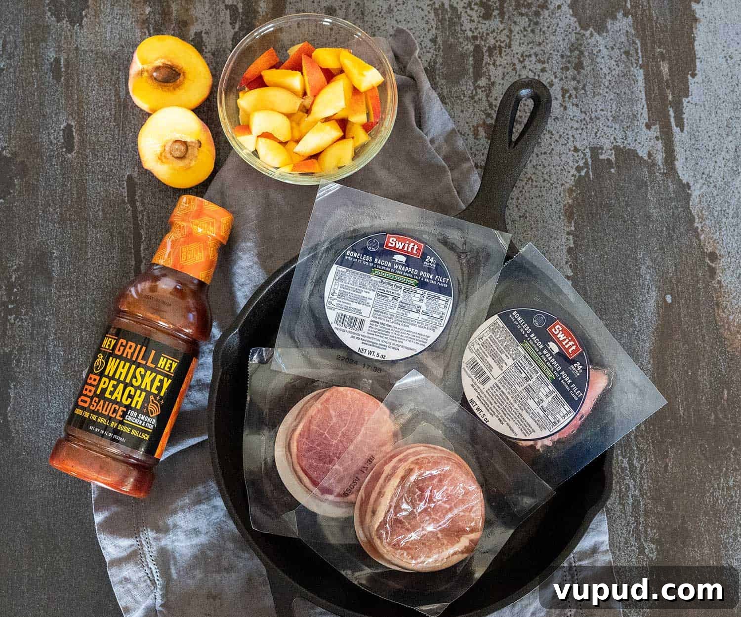 Whiskey-Peach Glazed Bacon-Wrapped Pork Loin Filets 3 Swift Meats bacon-wrapped pork loin filets and Hey Grill Hey Whiskey Peach BBQ Sauce