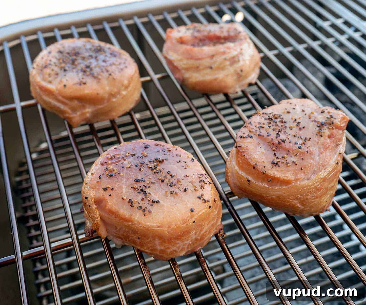 Whiskey-Peach Glazed Bacon-Wrapped Pork Loin Filets 6 bacon-wrapped pork loin filets on grill