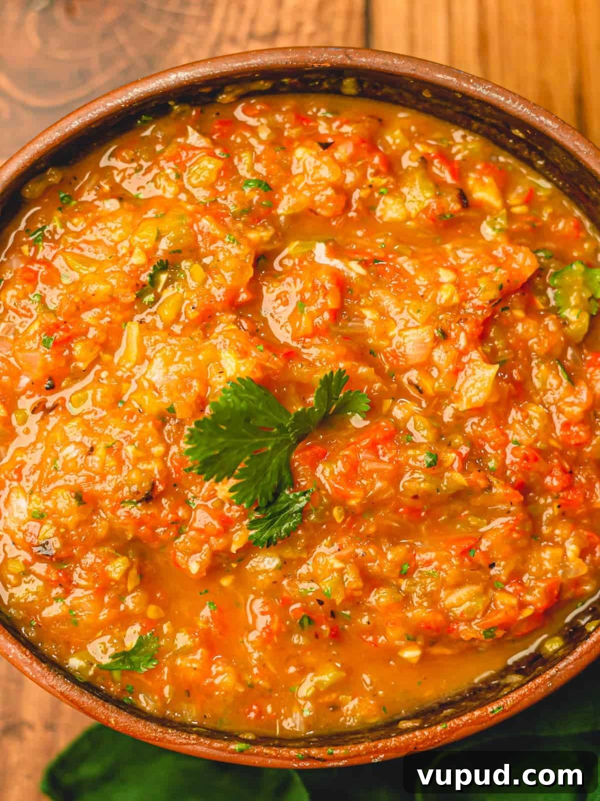 Smoky Roasted Tomato and Habanero Salsa Recipe 2 Tomato and habanero salsa in a brown bowl.