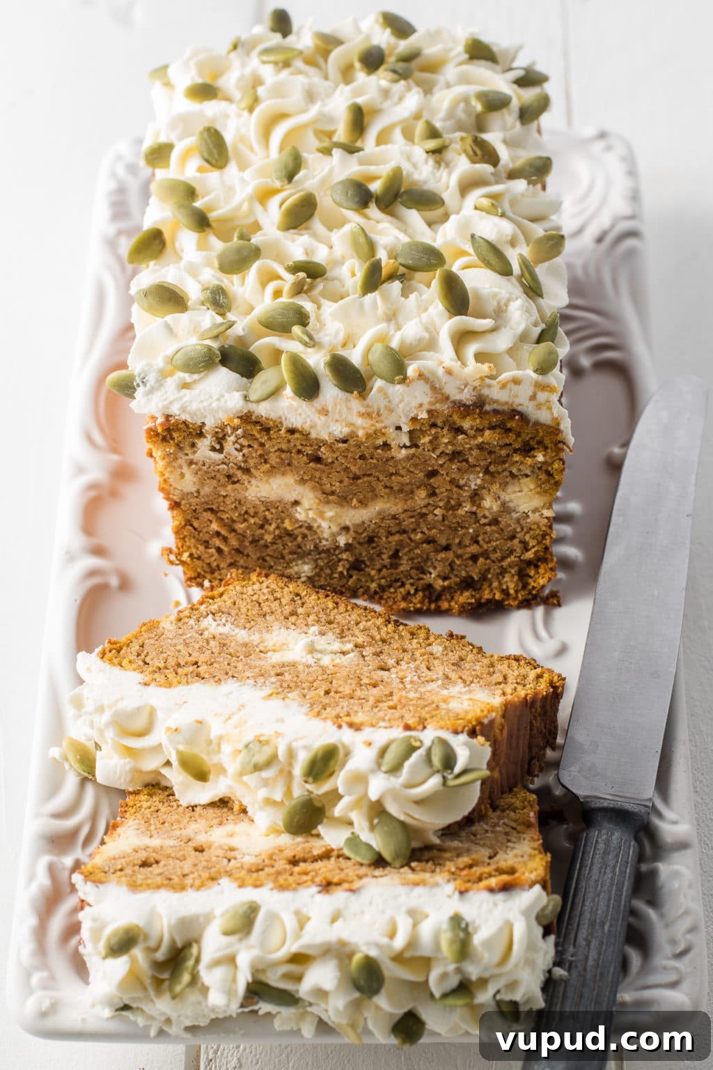 Low-Carb Spiced Pumpkin Bread Stuffed with Cheesecake 2 Low carb pumpkin loaf sliced and on display.