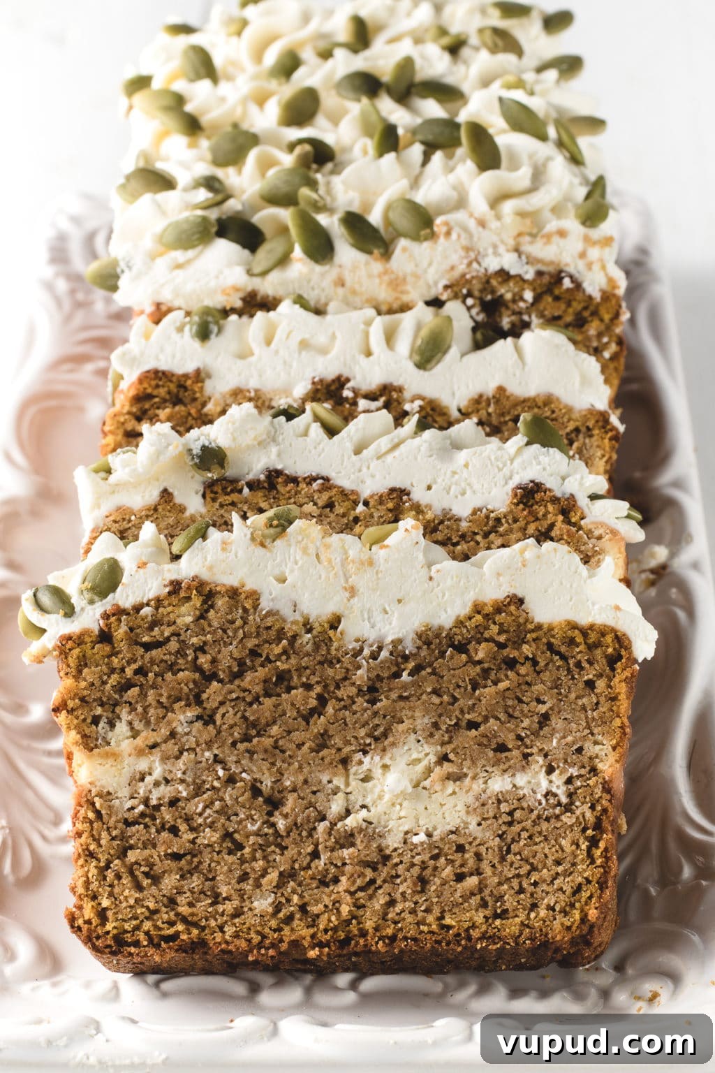Low-Carb Spiced Pumpkin Bread Stuffed with Cheesecake 5 Slices of low carb pumpkin bread laid out on a serving tray.