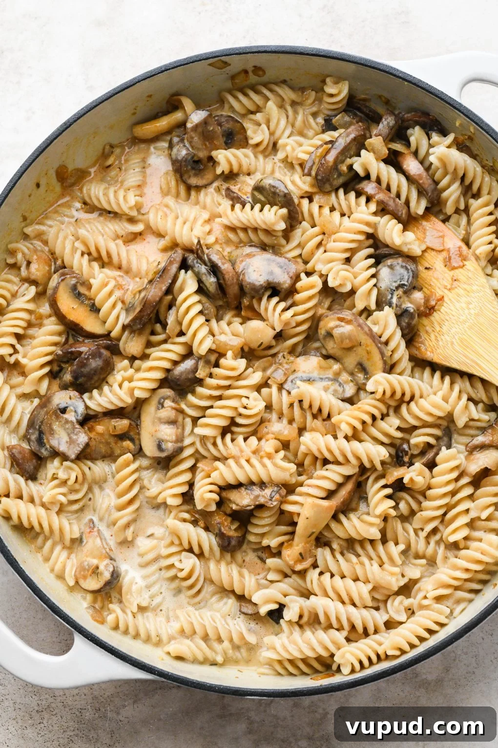 Cashew Cream Mushroom Stroganoff (Gluten-Free) 11 How to make creamy vegan mushroom stroganoff: Mushrooms and pasta tossed with cashew cream sauce before simmering.