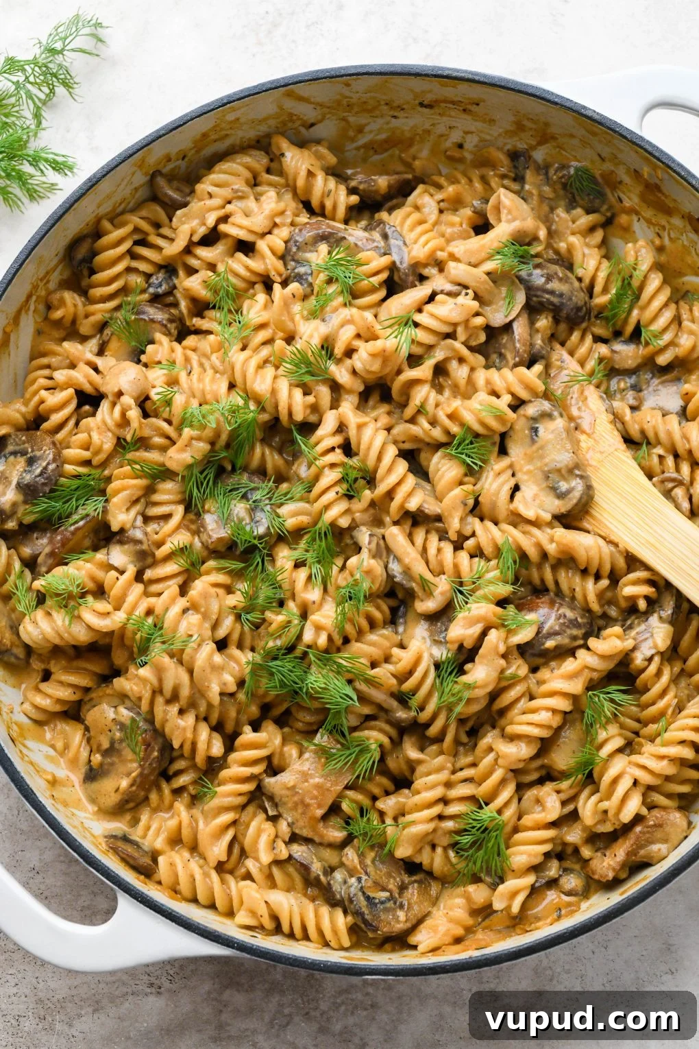 Cashew Cream Mushroom Stroganoff (Gluten-Free) 14 A large ceramic skillet of creamy vegan mushroom stroganoff topped with fresh dill.