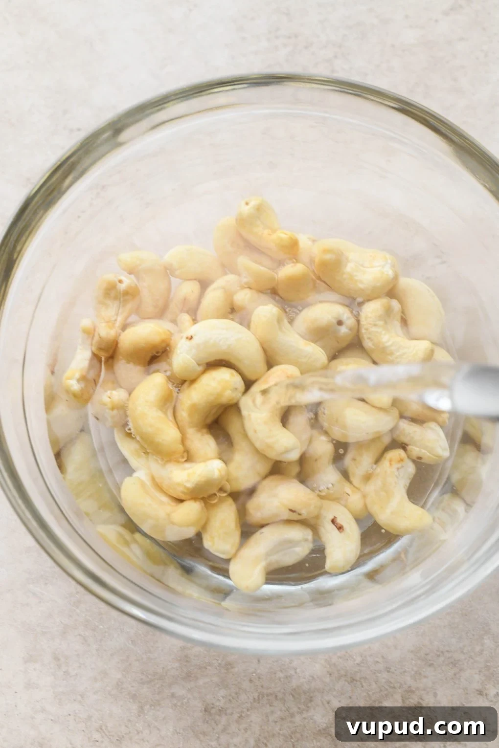 Cashew Cream Mushroom Stroganoff (Gluten-Free) 5 How to make creamy vegan mushroom stroganoff: Pouring hot water over cashews for cashew cream sauce.
