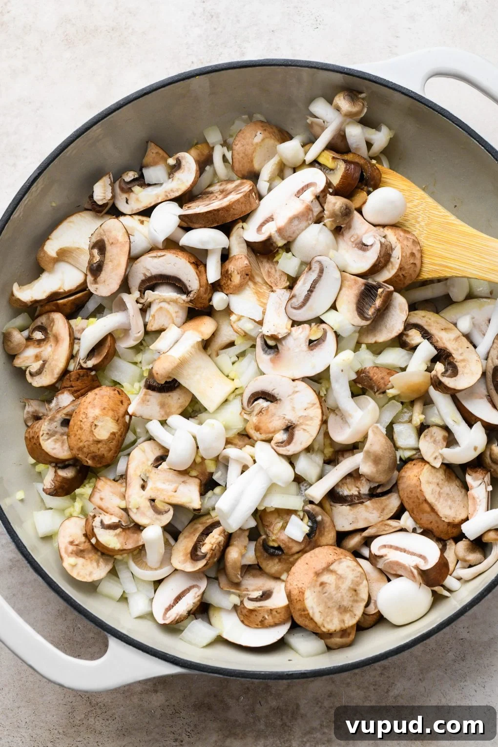 Cashew Cream Mushroom Stroganoff (Gluten-Free) 6 How to make creamy vegan mushroom stroganoff: Raw mushrooms, onion, and garlic in a large ceramic skillet.