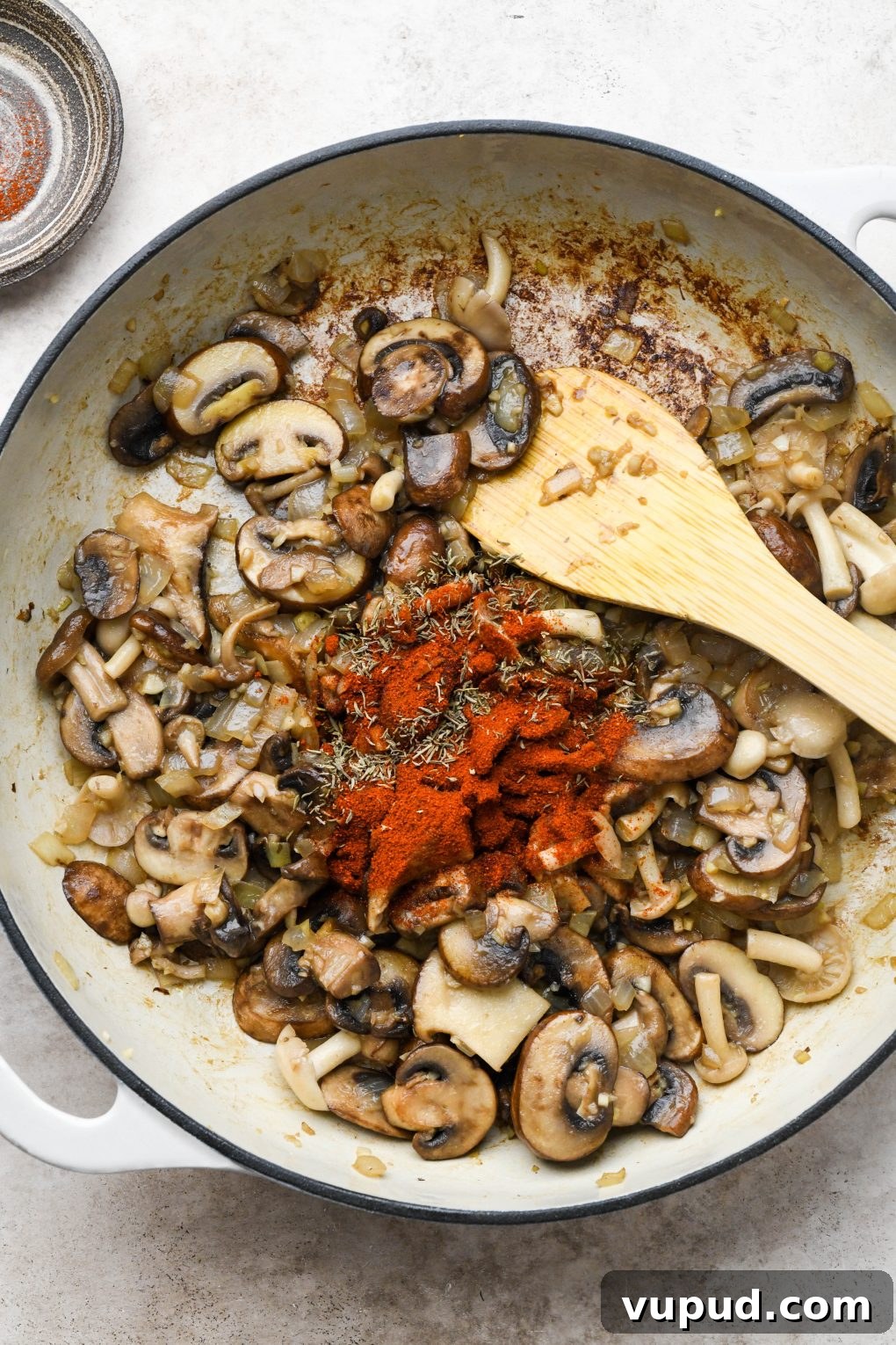 Cashew Cream Mushroom Stroganoff (Gluten-Free) 7 How to make creamy vegan mushroom stroganoff: Cooked mushrooms, onions, and garlic in a large ceramic skillet with paprika and thyme on top of veggies.