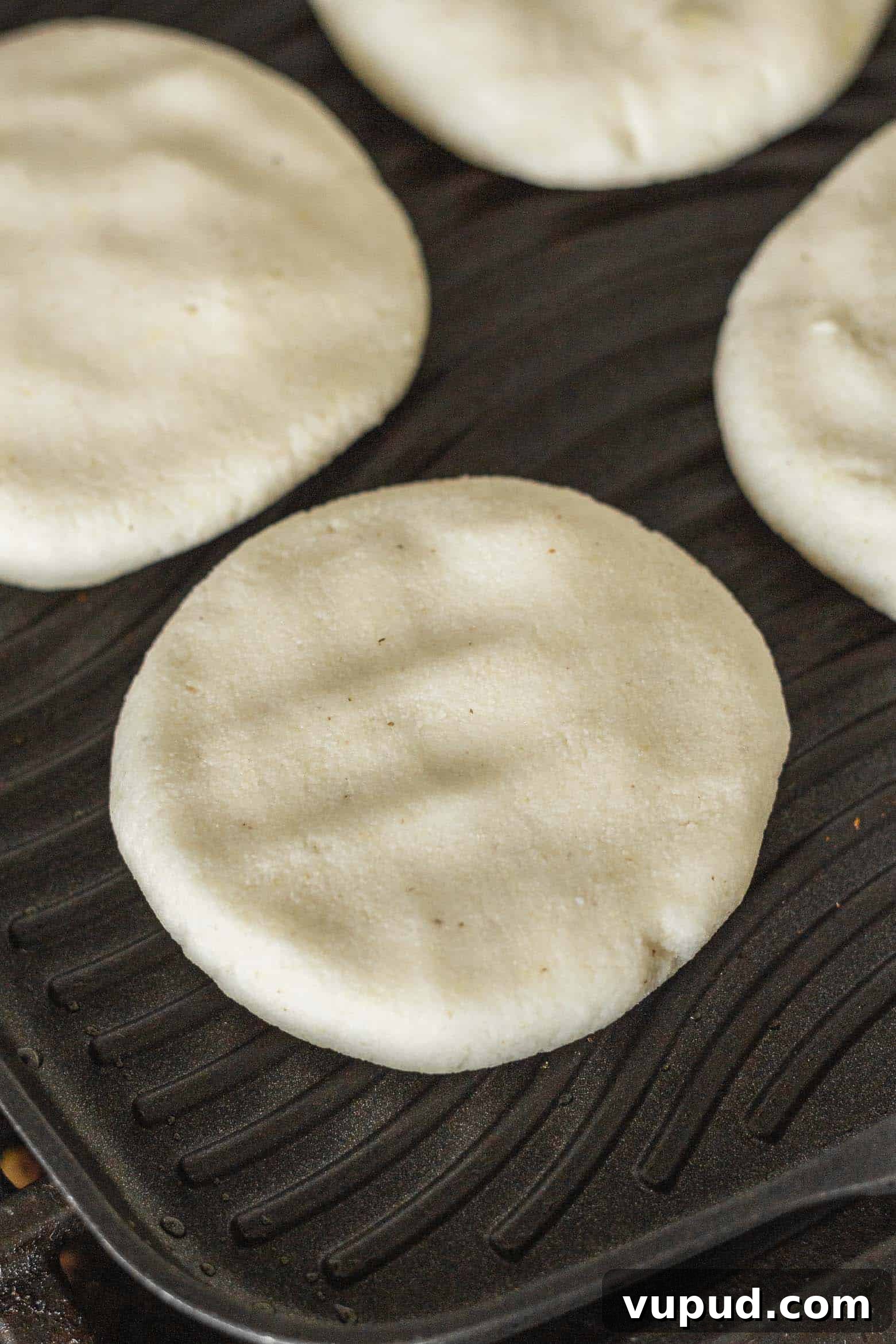 Reina Pepiada Arepa: Venezuelan Chicken & Avocado Recipe 8 Uncooked arepas on a grill