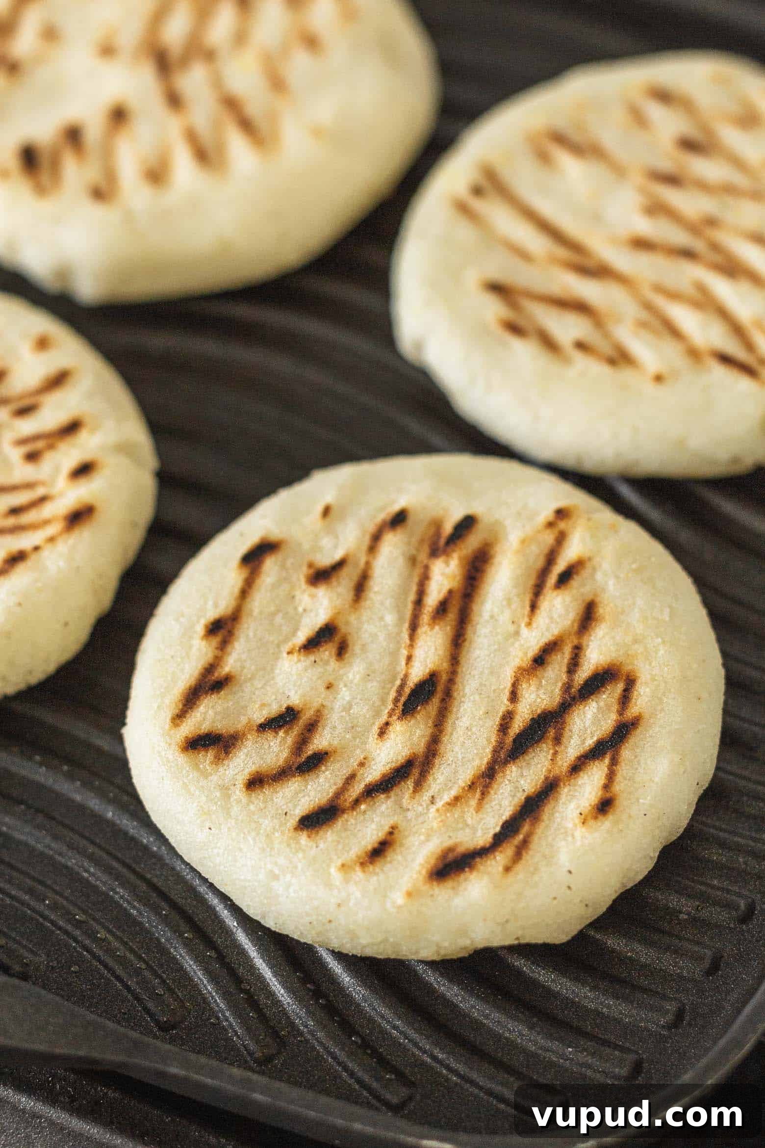 Reina Pepiada Arepa: Venezuelan Chicken & Avocado Recipe 9 Arepas cooking on a grill