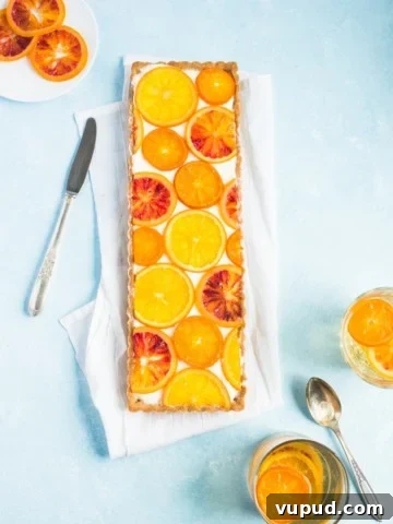 This mimosa tart is everything you love about brunch and then some! With it's bright candied oranges, boozy champagne filling and to-die-for graham cracker crust, what's not to love?