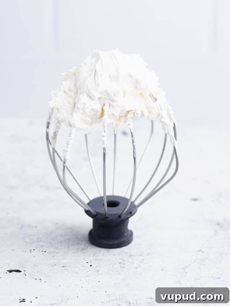 Zesty Key Lime Cookies Recipe: Tangy Citrus Cookie Delight 7 White frosting on the whip attachment for a kitchen aid.