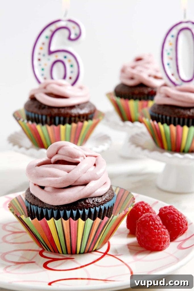 Chocolate Raspberry Cupcakes with Fresh Raspberry Buttercream 2 Close up of cupcakes in decorative wrappers with birthday number candles