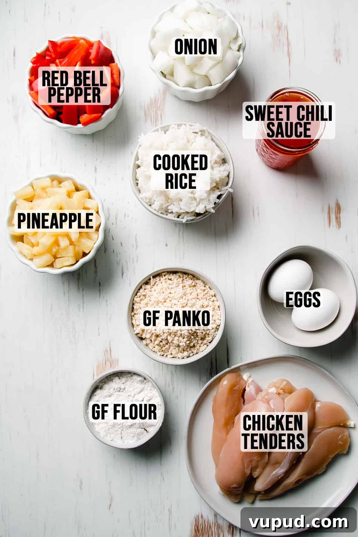 Gluten-Free Sweet Fire Chicken Recipe — Panda Express Copycat 2 Ingredients needed for gluten free sweet fire chicken measured out in bowls on white wooden surface.