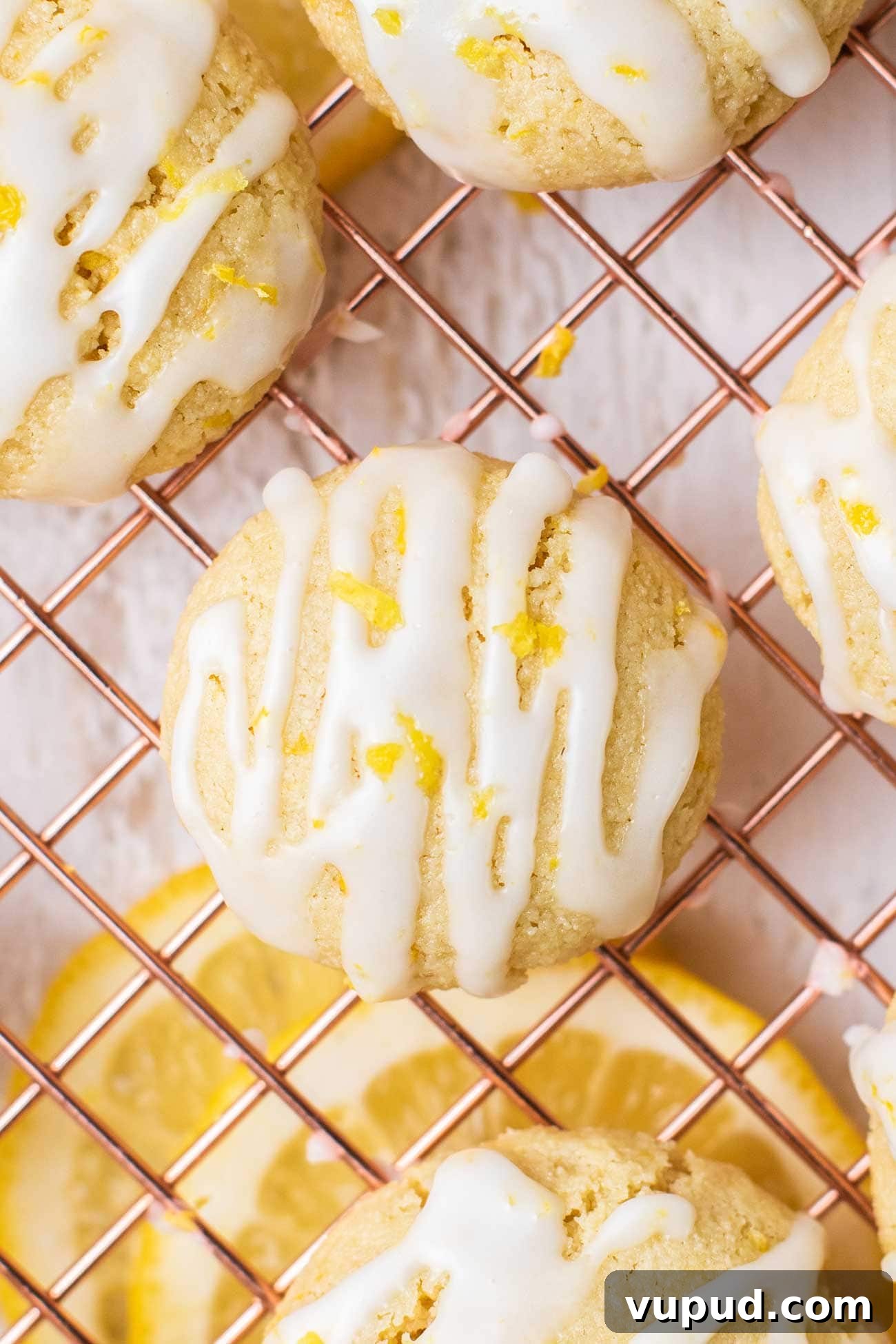 Chewy Gluten-Free Lemon Cookies (Dairy-Free Recipe) 2 A close up look at a lemon cookie drizzled with a lemon glaze.